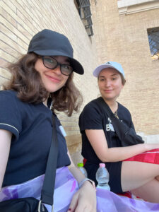two girls sitting outside in Rome